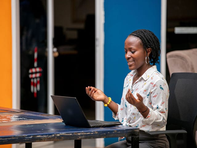 Woman speaking on a video call at a laptop